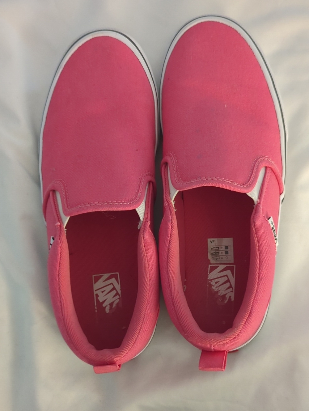 Vans Slip-On Canvas Sneakers in Bright Pink